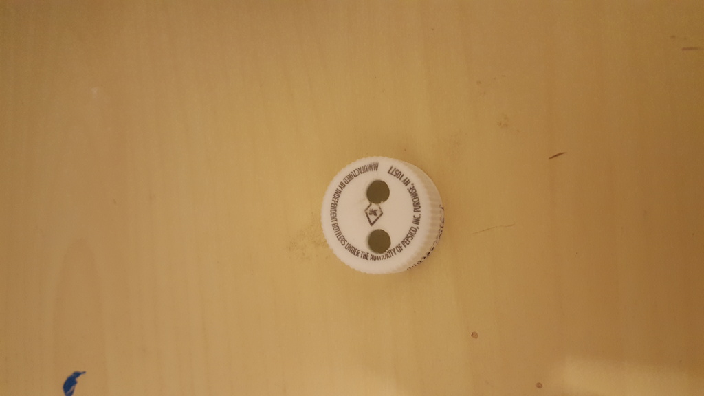 Picture of bottle cap holes.